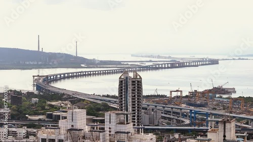 Aerial view of Sewri Nhava Sheva Trans Harbour Link in Mumbai city in Maharashtra, India. Beautiful cloudy weather during monsoon. photo