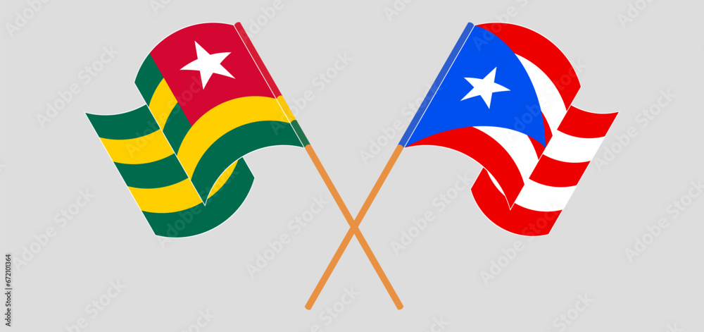 Crossed and waving flags of Togo and Puerto Rico