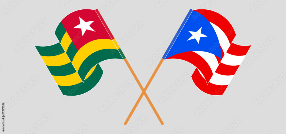 Crossed and waving flags of Togo and Puerto Rico Crossed and waving flags of Togo and Puerto Rico