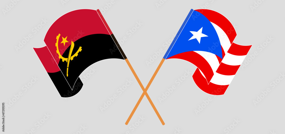 Crossed and waving flags of Angola and Puerto Rico