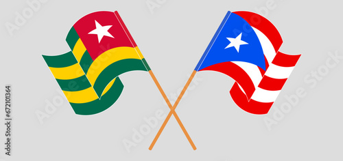 Crossed and waving flags of Togo and Puerto Rico