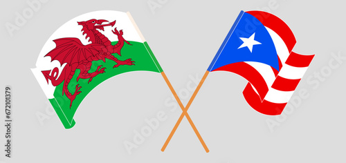 Crossed and waving flags of Wales and Puerto Rico