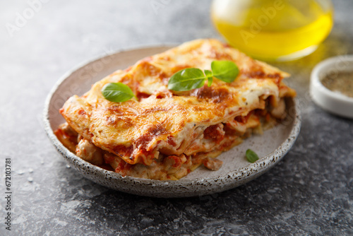 Traditional homemade lasagna with fresh basil