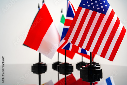 Lots of small national flags on table