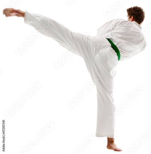 Side view of young man, karate, taekwondo athlete in kimono and green belt training isolated transparent background. Concept of martial arts, combat sport, energy, strength, health. Ad