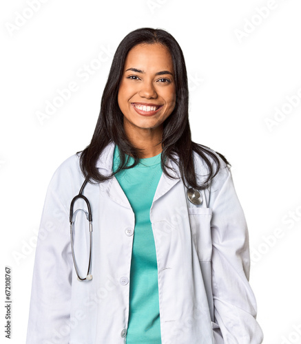 Young Filipina doctor with stethoscope in studio happy, smiling and cheerful.