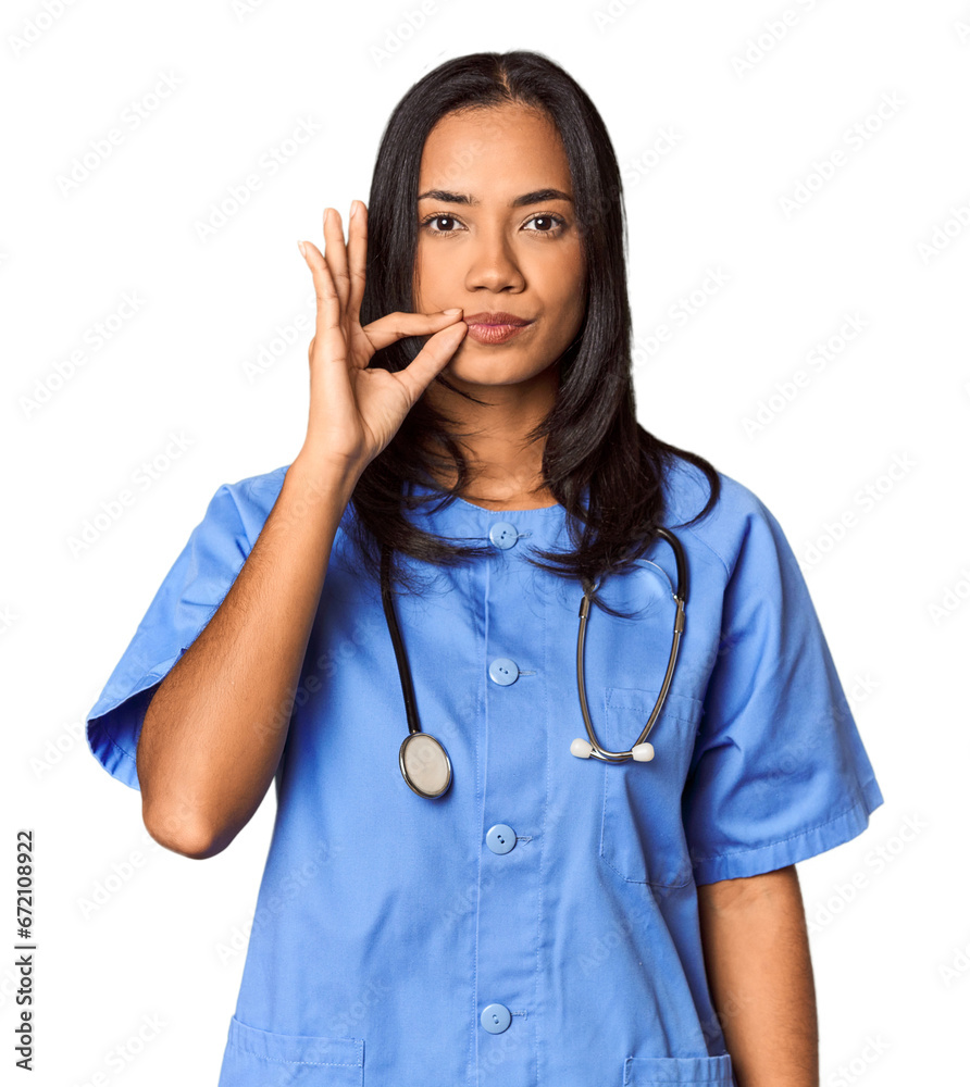 Young Filipina nurse posed in studio with fingers on lips keeping a secret. Young Filipina nurse posed in studio with fingers on lips keeping a secret.