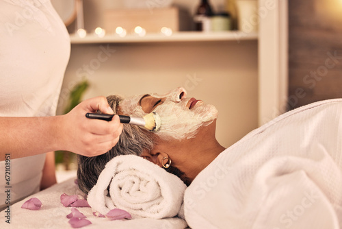 Woman, relax and brush face mask at spa, skincare treatment and zen therapy in beauty salon. Calm mature female person at wellness resort for facial cleaning, hydration cosmetics and dermatology glow