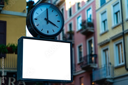 Fototapeta Naklejka Na Ścianę i Meble -  Blank white poster under a clock in Milan.	
