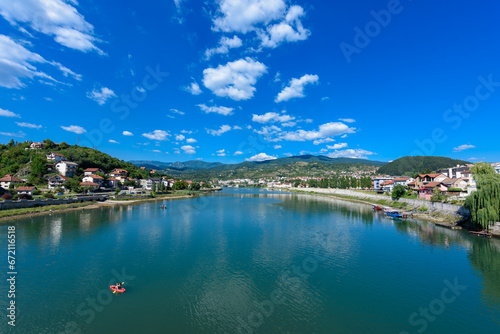 Visegrad, Republic of Srpska, Bosnia and Herzegovina - August 13, 2023: View of the city of Visegrad in Bosnia and Herzegovina and the Drina River  © nedomacki
