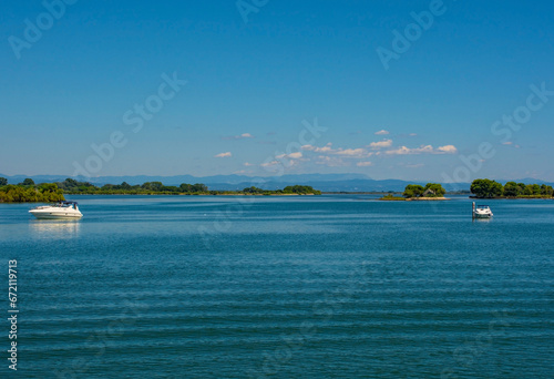 Fototapeta Naklejka Na Ścianę i Meble -  Shallow waters in the Grado section of the Marano and Grado Lagoon in Friuli-Venezia Giulia, north east Italy. August