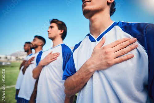Football team, national anthem and listening at stadium before competition, game or match. Soccer, song and sports players together for pride, collaboration for contest or exercise with hands closeup © C. Daniels/peopleimages.com