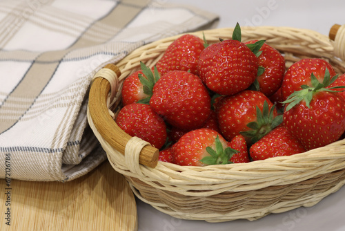 basket with fresh strawberries isolated on the table