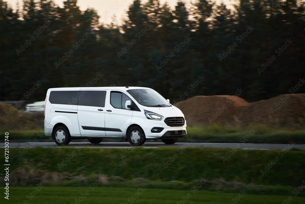 Commercial van on the road. Delivery van close-up mockup isolated. Final destination shipping truck mock-up.