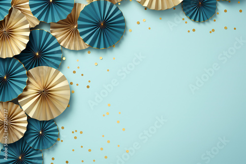 Christmas festive greeting template  gold and blue paper fans border with round confetti on a pastel blue background with copy space.