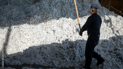 Pastdargam disctrict, Juma city, uzbekistan, October 31, 2023: man in Industry working with cottons photo
