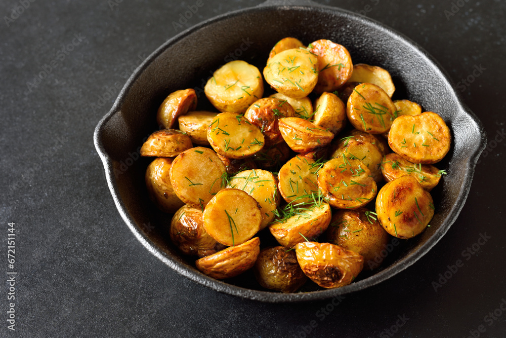 Roasted potatoes in frying pan Roasted potatoes in frying pan