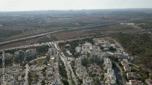 A busy highway near a city.
A neighborhood on the outskirts of Tel Aviv Israel.
All around agricultural fields, and on the horizon the towers of Tel Aviv, photo