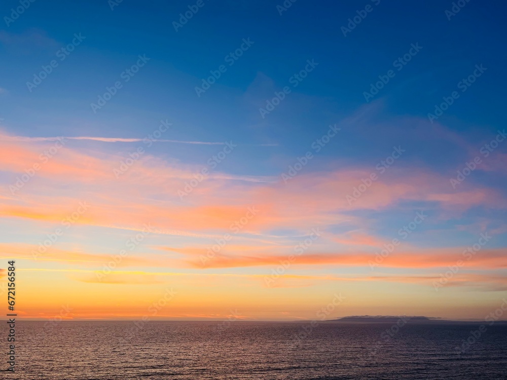 Beautiful colorful sky after the sunset at the sea coast, natural colors, sunset seascape background
