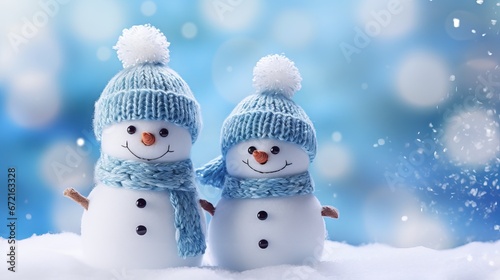 Handmade snowmen on fluffy snow with blue sky background - Christmas and holiday concept © Ameer