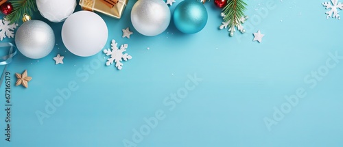 Christmas and New Year greeting card with ornaments and gift on blue background with copy space