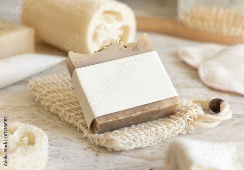 Beige handmade soap bar with blank label close up, packaging mockup