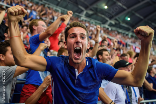 A football fan cheers for his team at the stadium