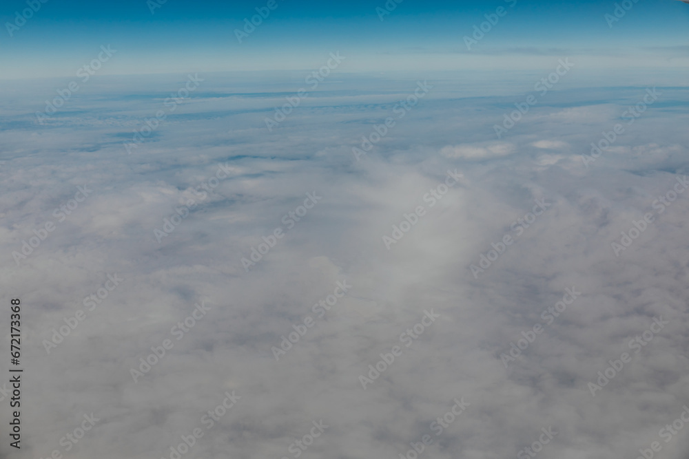 Beautiful landscape blue sky over clouds from airplane Beautiful landscape blue sky over clouds from airplane