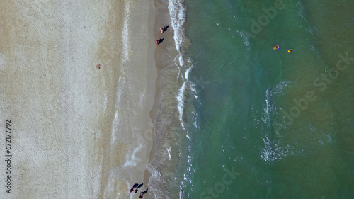 Top view of a beautiful sandy beach and sea waves. Rimini, Italy