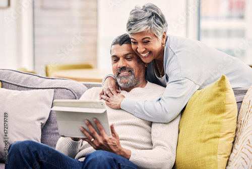 Tablet, video call and senior couple embracing while networking on social media or mobile app. Happy, communication and mature man and woman on a virtual conversation on digital technology at home.