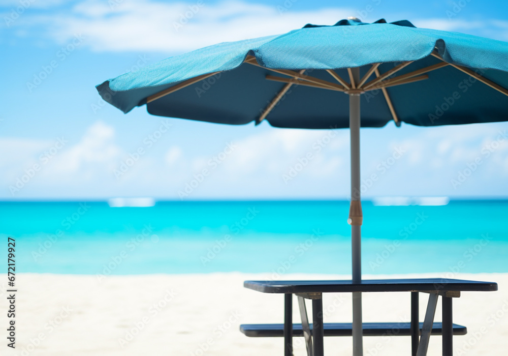 Sunny tropical beach and ocean with sun umbrella