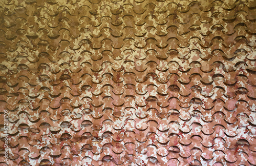Camouflage net texture on high wall outdoors as background close up