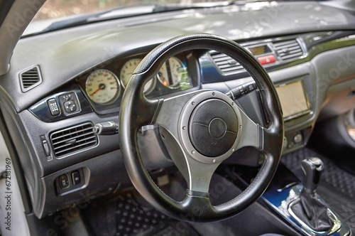 Car steering wheel and car sensors, inerior background, modern city car elements close view. Car inside interior