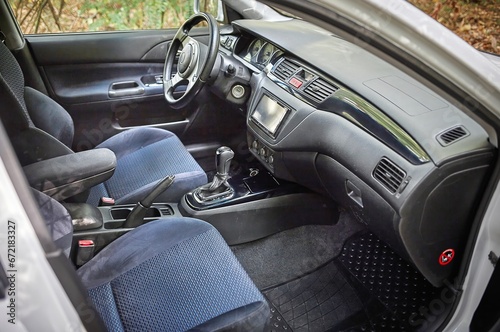 Car steering wheel and car sensors, inerior background, modern city car elements close view. Car inside interior © Studio-M