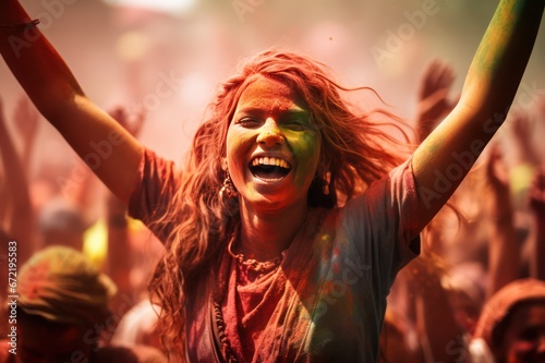 young woman at holi festival in India covered with colorful paint powder. Travel and celebrating holidays. Non western tradition.