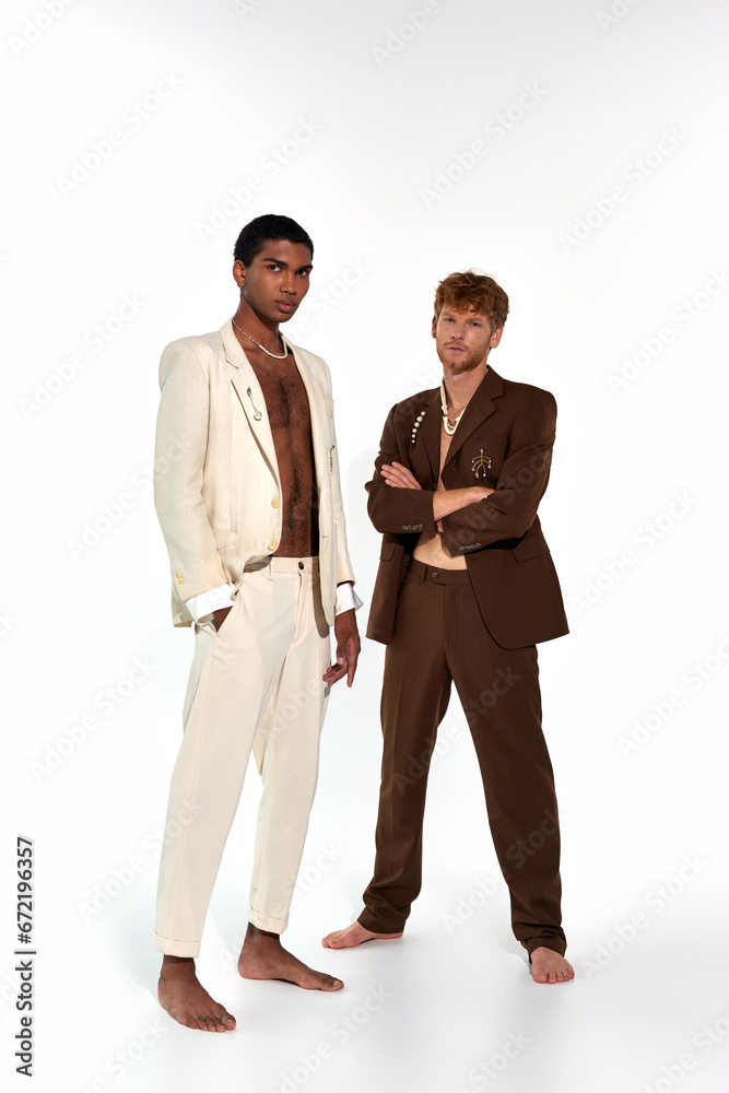 good looking diverse male models in elegant sexy suits with accessories looking at camera, men power good looking diverse male models in elegant sexy suits with accessories looking at camera, men power