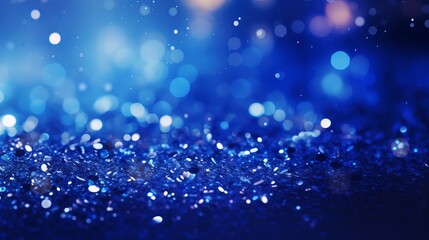 Sapphire glitter bokeh background with shimmering royal blue sparkles and crystal droplets