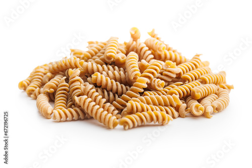 Raw whole grain fusilli pasta. Uncooked pasta isolated on white background. photo