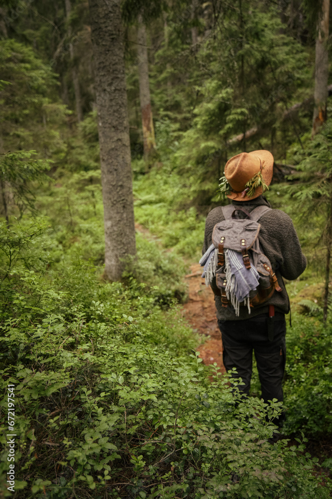 person in the forest with a hat person in the forest with a hat