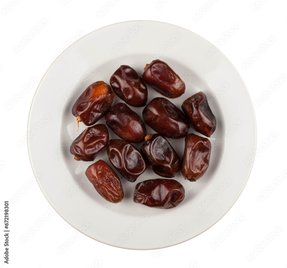 Dates on a plate on a white background Dates on a plate on a white background