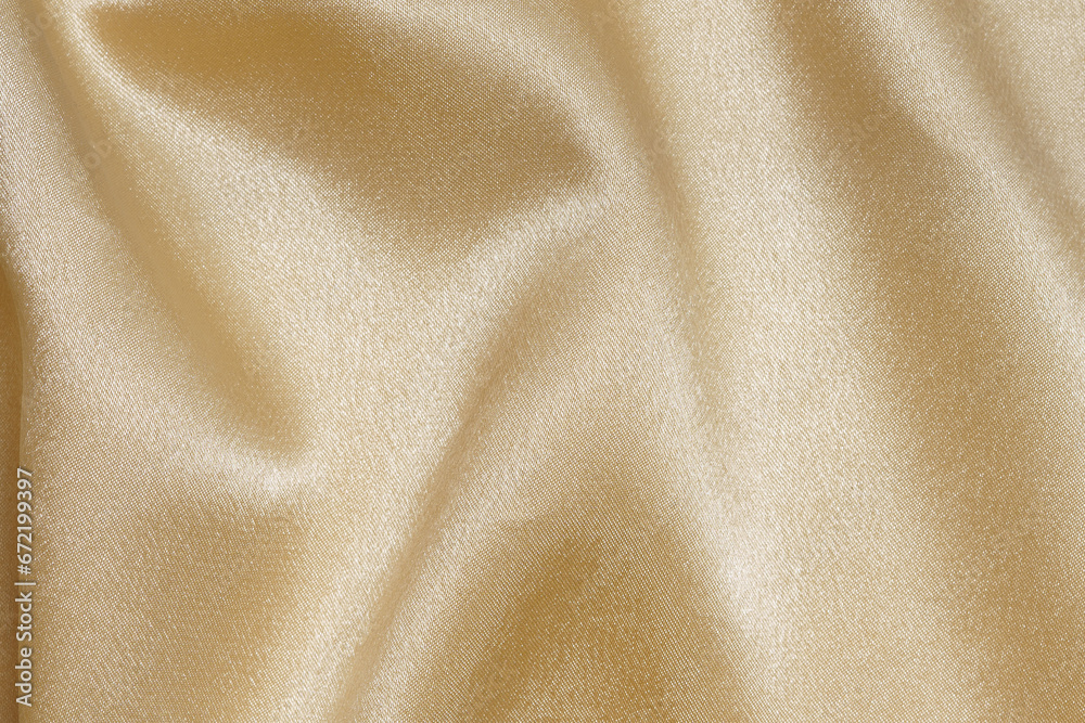 texture crumpled wrinkled golden or yellow fabric with glare close-up. elegant background for your design. material for sewing festive costumes and clothes texture crumpled wrinkled golden or yellow fabric with glare close-up. elegant background for your design. material for sewing festive costumes and clothes