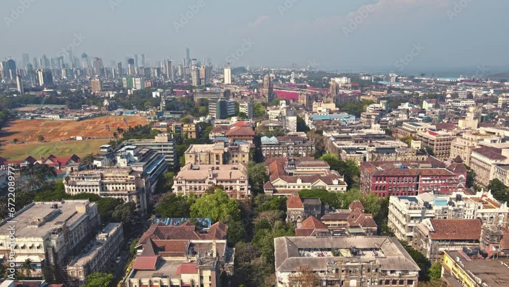 Cinematic Aerial of View Mumbai City. 4k, Drone flying above the Indian city. Modern City high-rise skyscraper buildings and busy roads in the daytime in Mumbai City. Cinematic Aerial of View Mumbai City. 4k, Drone flying above the Indian city. Modern City high-rise skyscraper buildings and busy roads in the daytime in Mumbai City.