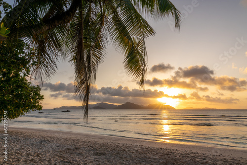 Sunset at the scenic tropical beach of Anse Severe, La Digue island, Seychelles
