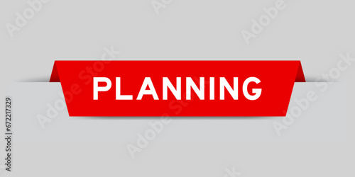 Red color inserted label with word planning on gray background