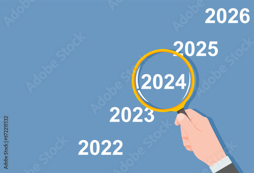 Businessman hand holding magnifier glass focus number 2024. Business investment economy and financial planning concept. Vector illustration flat design with copy space.