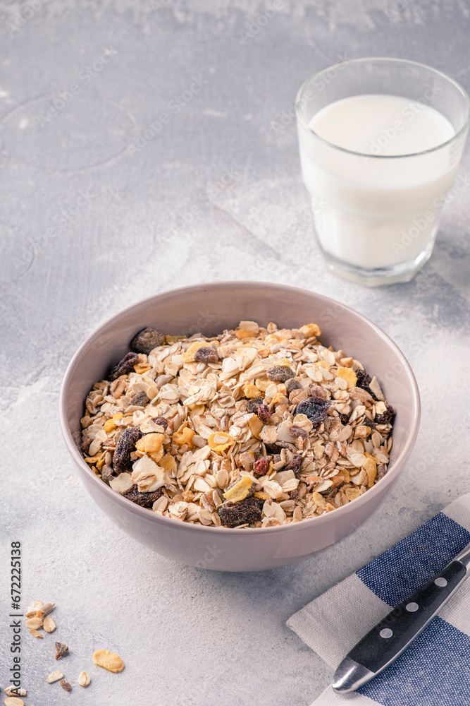 Flakes, nuts and raisin with milk for breakfast. Dry breakfast concept Flakes, nuts and raisin with milk for breakfast. Dry breakfast concept