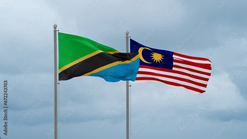 Malaysia and Tanzania flag waving together on cloudy sky, endless seamless loop, two country cooperation concept Malaysia and Tanzania flag waving together on cloudy sky, endless seamless loop, two country cooperation concept