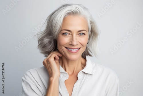 Cheerful beautiful 50s mid aged mature woman isolated on white background. skin care beauty, skincare cosmetics concept