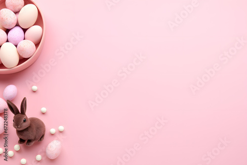 Image of eggs and rabbit in easter theme on pink color background 