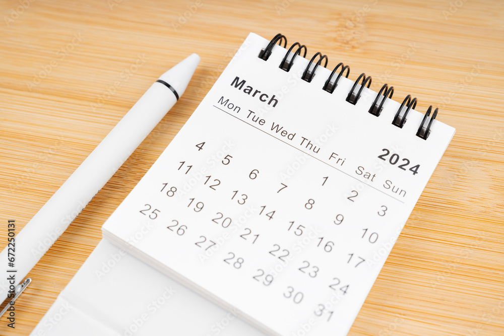 March 2024 Monthly desk calendar for 2024 year with pen. March 2024 Monthly desk calendar for 2024 year with pen.